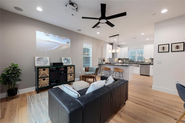 7812 Mullen Dr Unit 2, Austin, TX 78757 - living room featuring ceiling fan, light wood-style flooring, baseboards, and recessed lighting