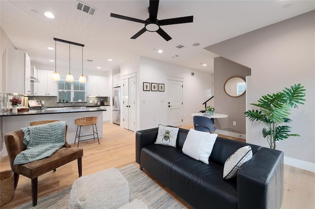 7812 Mullen Dr Unit 2, Austin, TX 78757 - living area featuring ceiling fan, light wood finished floors, recessed lighting, and baseboards