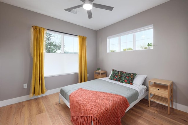 7812 Mullen Dr Unit 2, Austin, TX 78757 - bedroom with baseboards, wood finished floors, and ceiling fan