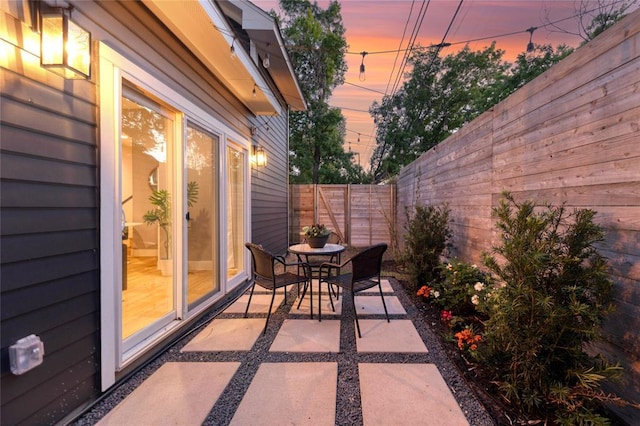 7812 Mullen Dr Unit 2, Austin, TX 78757 - patio terrace at dusk with a fenced backyard