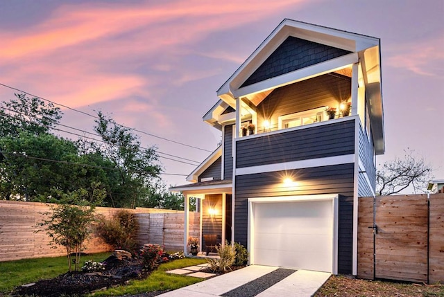 7812 Mullen Dr Unit 2, Austin, TX 78757 - contemporary house with a balcony, a garage, fence, and concrete driveway
