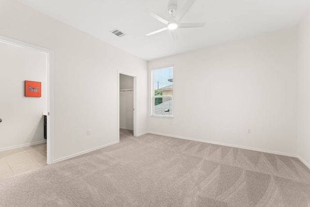 9528 Hunter Ln, Austin, TX 78748 - unfurnished bedroom with light colored carpet, baseboards, and a spacious closet