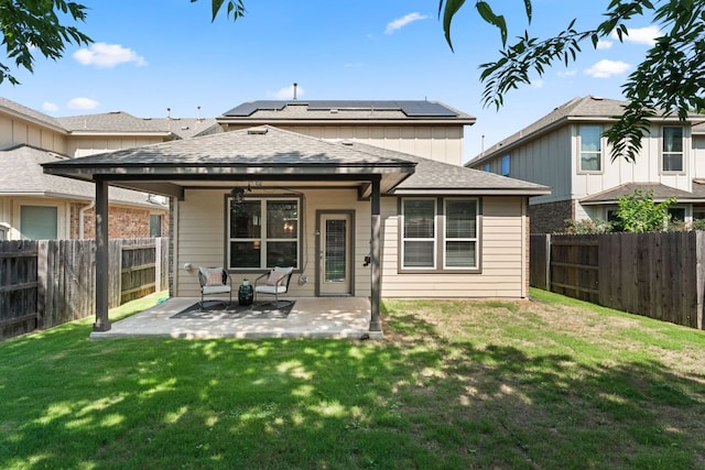 9528 Hunter Ln, Austin, TX 78748 - rear view of house with solar panels, a patio, and roof with shingles