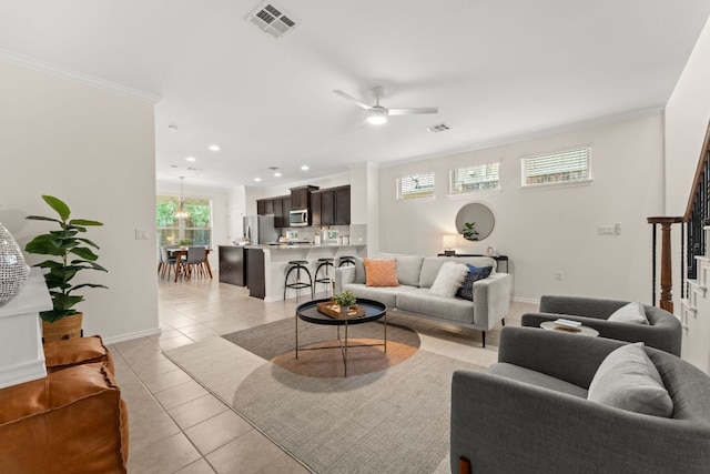 9528 Hunter Ln, Austin, TX 78748 - living area with crown molding, light tile patterned flooring, recessed lighting, ceiling fan, and baseboards