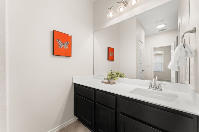 9528 Hunter Ln, Austin, TX 78748 - bathroom with vanity, tile patterned flooring, and baseboards