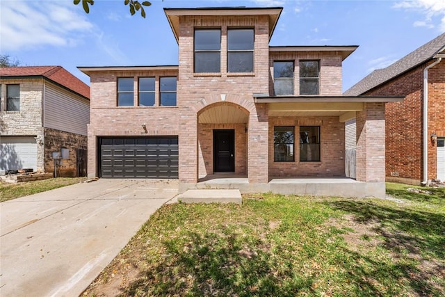 2003 Carriage Club Dr, Cedar Park, TX 78613 - contemporary house featuring an attached garage, driveway, brick siding, and a porch