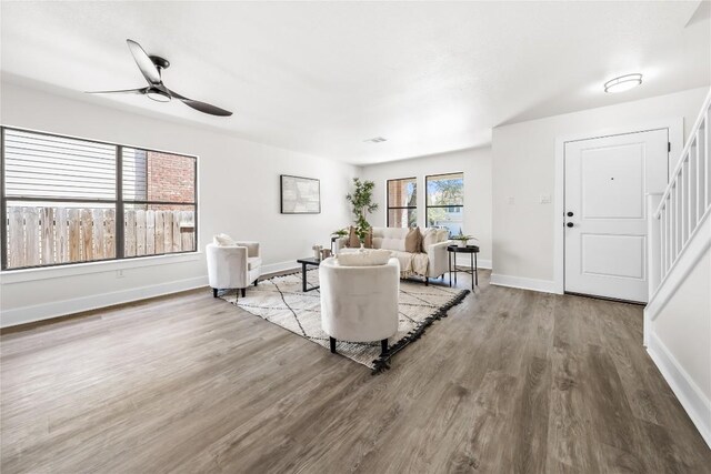2003 Carriage Club Dr, Cedar Park, TX 78613 - living area featuring wood finished floors, stairway, and a ceiling fan