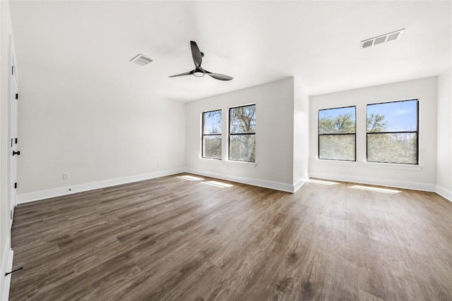 2003 Carriage Club Dr, Cedar Park, TX 78613 - empty room with plenty of natural light, dark wood finished floors, and ceiling fan