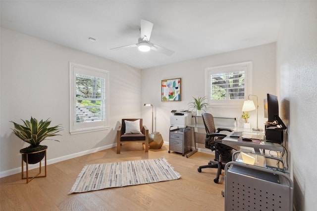 8900 Rockcrest Dr, Austin, TX 78759 - home office with healthy amount of natural light, wood finished floors, and a ceiling fan