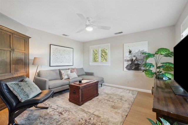 8900 Rockcrest Dr, Austin, TX 78759 - living area featuring light wood-type flooring, baseboards, and ceiling fan