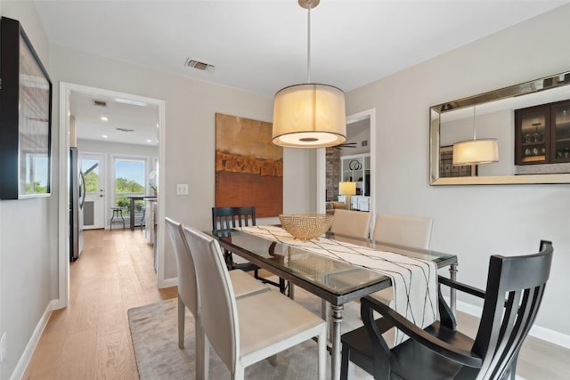 8900 Rockcrest Dr, Austin, TX 78759 - dining space with light wood-style flooring and baseboards