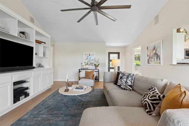 8900 Rockcrest Dr, Austin, TX 78759 - living area featuring vaulted ceiling, a ceiling fan, and wood finished floors