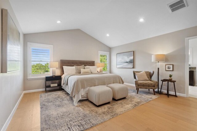 8900 Rockcrest Dr, Austin, TX 78759 - bedroom featuring wood finished floors, vaulted ceiling, baseboards, and recessed lighting