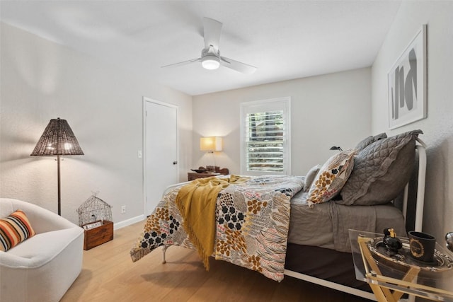 8900 Rockcrest Dr, Austin, TX 78759 - bedroom with wood finished floors and a ceiling fan