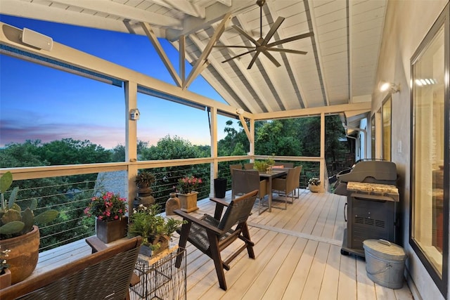 8900 Rockcrest Dr, Austin, TX 78759 - deck at dusk with outdoor dining space and a ceiling fan