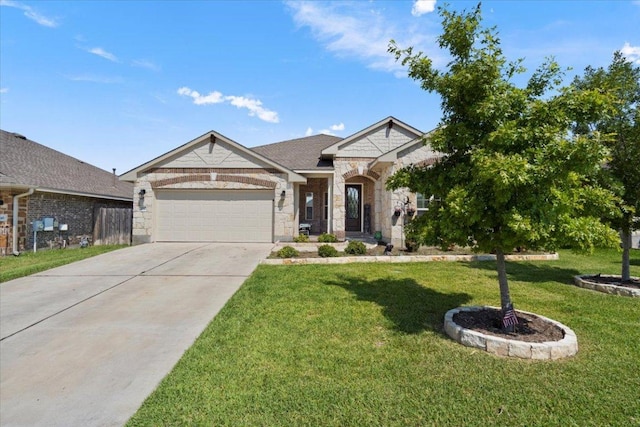 view of front facade with stone siding, a garage, a front yard, and driveway