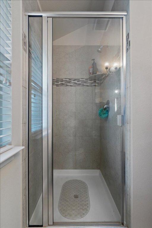 full bath featuring a stall shower