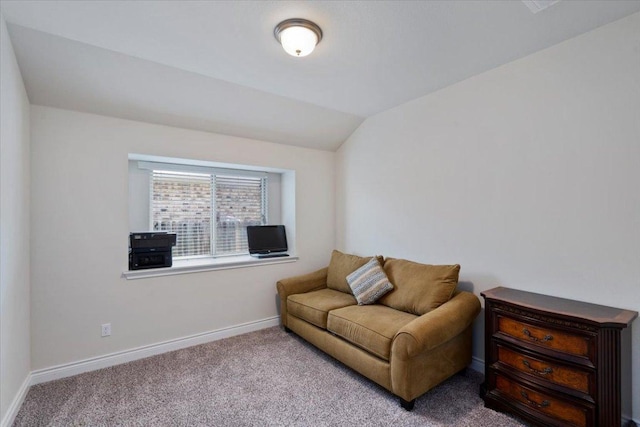sitting room with carpet flooring, baseboards, and lofted ceiling