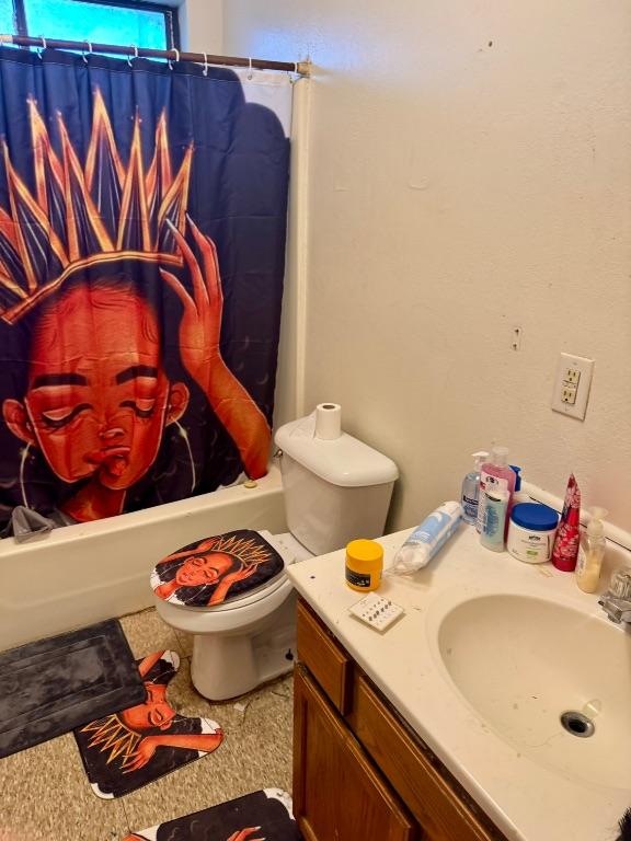 15 S 19th St, Temple, TX 76504 - bathroom featuring vanity, toilet, and shower / bath combo with shower curtain
