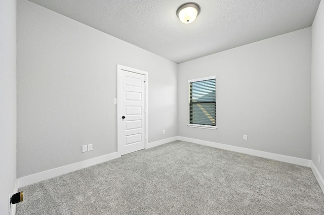 16708 Rakesh Way, Manor, TX 78653 - carpeted empty room with a textured ceiling and baseboards