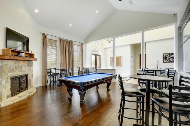 16708 Rakesh Way, Manor, TX 78653 - recreation room featuring high vaulted ceiling, a stone fireplace, billiards table, wood finished floors, and recessed lighting