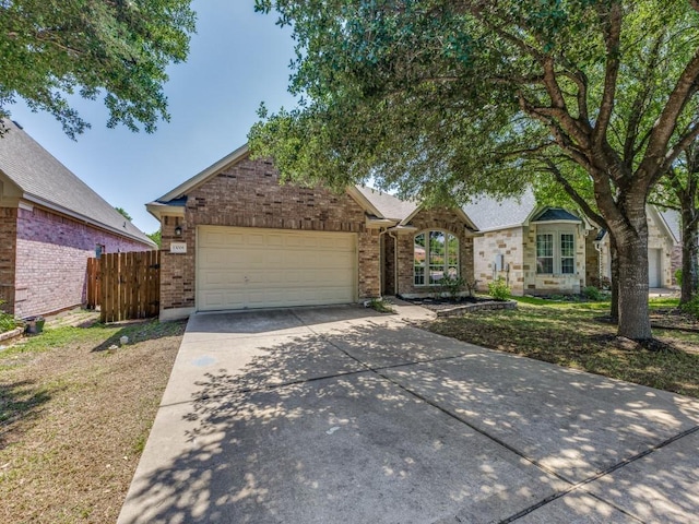13008 Kenswick Dr, Austin, TX 78753 - view of front of property featuring brick siding, concrete driveway, and a garage