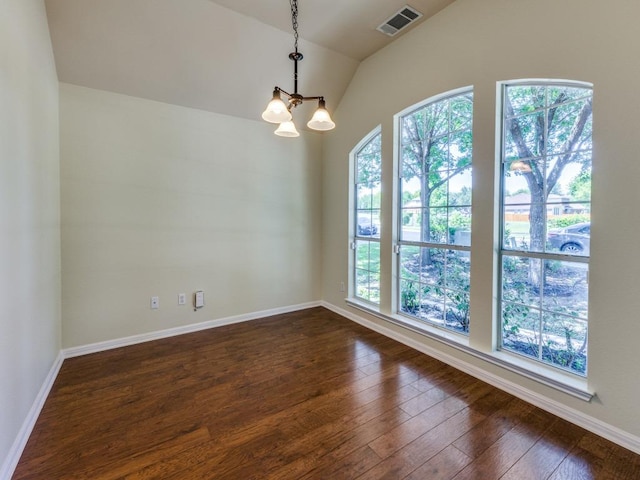 unfurnished room with a chandelier, dark wood-style floors, lofted ceiling, and baseboards