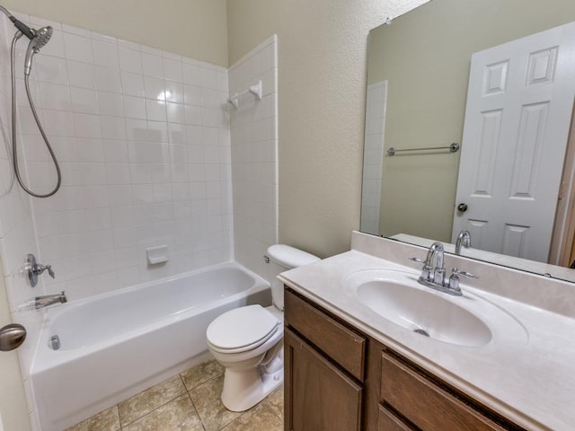 bathroom featuring toilet, shower / washtub combination, vanity, and tile patterned flooring