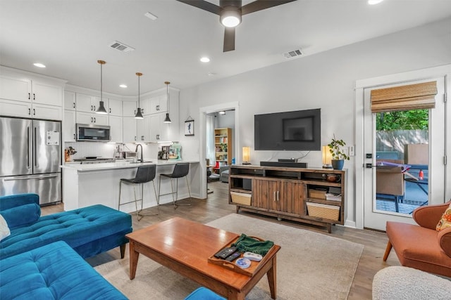 5308 Evans Ave Unit 2, Austin, TX 78751 - living area featuring recessed lighting, light wood-type flooring, ceiling fan, and baseboards