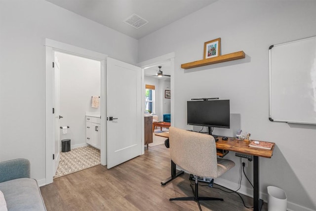 5308 Evans Ave Unit 2, Austin, TX 78751 - office with light wood-style flooring, ceiling fan, and baseboards