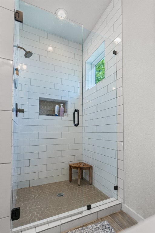 5308 Evans Ave Unit 2, Austin, TX 78751 - full bath featuring a stall shower and wood finished floors