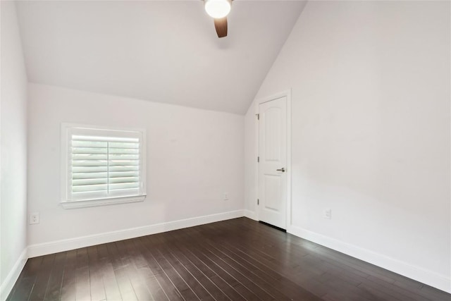906 Linden St Unit A, Austin, TX 78702 - empty room featuring ceiling fan, vaulted ceiling, dark wood-style floors, and baseboards