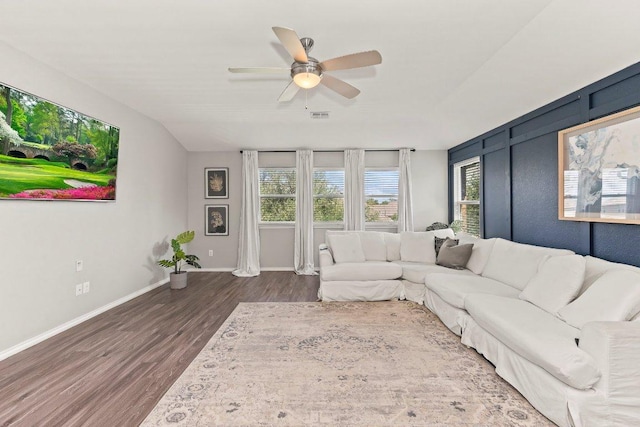 1116 Brenham Ln, Leander, TX 78641 - living area with wood finished floors, ceiling fan, and baseboards