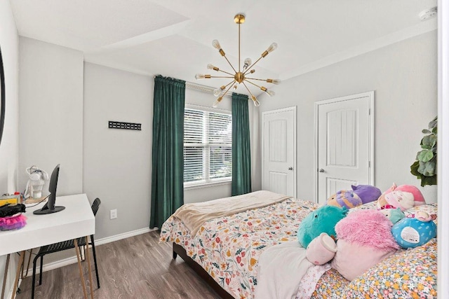 1116 Brenham Ln, Leander, TX 78641 - bedroom featuring a chandelier, wood finished floors, and baseboards