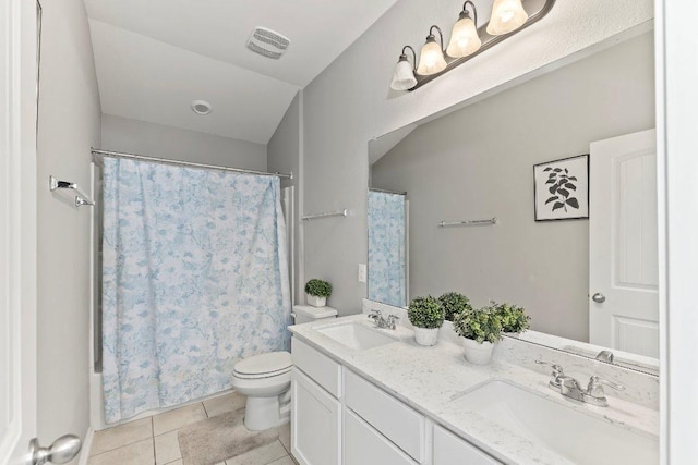 1116 Brenham Ln, Leander, TX 78641 - full bathroom featuring double vanity, toilet, tile patterned floors, and shower / bath combo with shower curtain