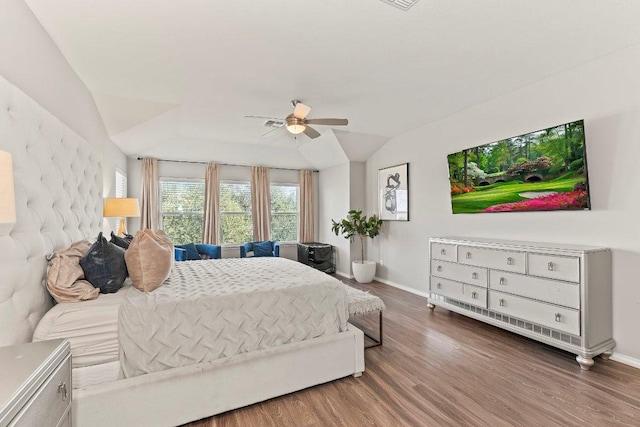 1116 Brenham Ln, Leander, TX 78641 - bedroom with baseboards, wood finished floors, vaulted ceiling, and a ceiling fan