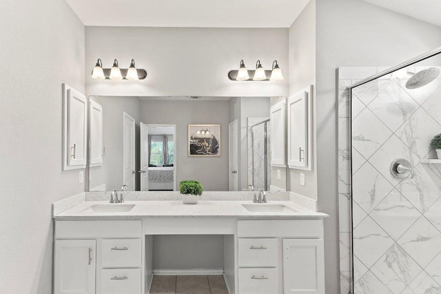 1116 Brenham Ln, Leander, TX 78641 - full bathroom featuring double vanity, a stall shower, ensuite bathroom, and tile patterned floors