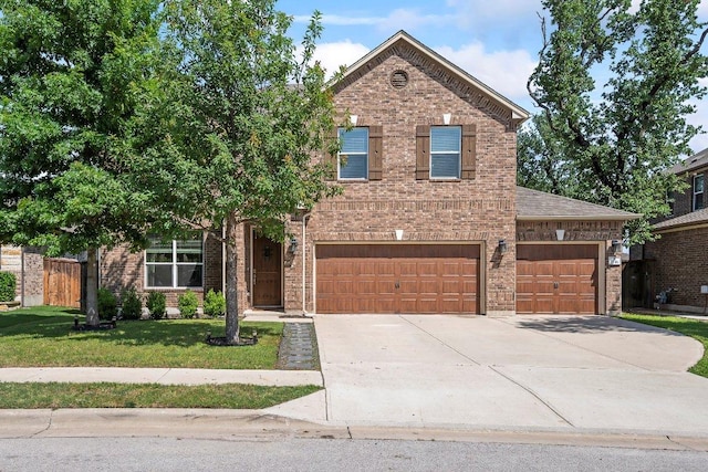 1116 Brenham Ln, Leander, TX 78641 - view of front facade featuring concrete driveway, brick siding, and an attached garage