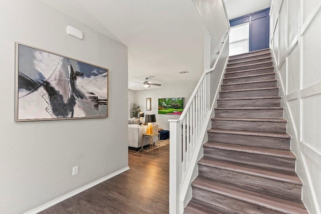 1116 Brenham Ln, Leander, TX 78641 - staircase with wood finished floors, ceiling fan, and baseboards
