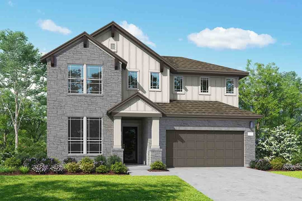 view of front of home featuring board and batten siding, stone siding, and a garage