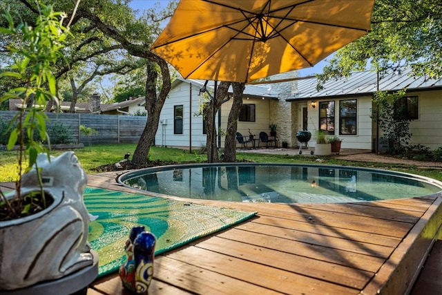 6905 Whispering Oaks Dr, Austin, TX 78745 - view of pool featuring a wooden deck and a fenced backyard