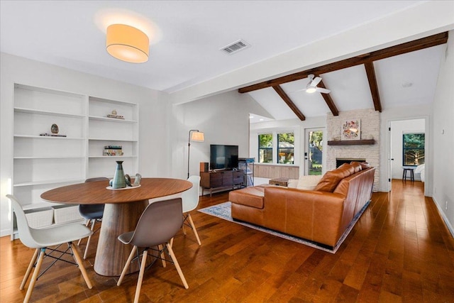 6905 Whispering Oaks Dr, Austin, TX 78745 - living room featuring dark wood finished floors, ceiling fan, and a fireplace