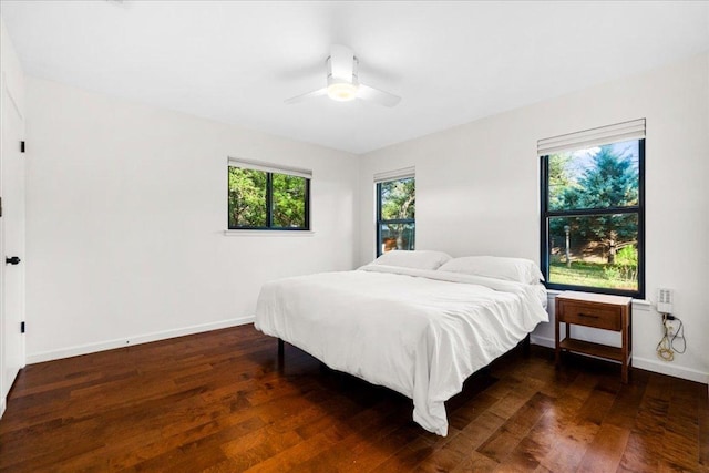 6905 Whispering Oaks Dr, Austin, TX 78745 - bedroom featuring wood finished floors, baseboards, and a ceiling fan