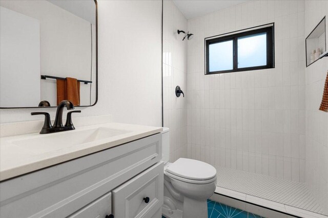 6905 Whispering Oaks Dr, Austin, TX 78745 - full bath featuring vanity, tiled shower, and toilet
