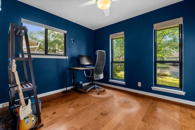 6905 Whispering Oaks Dr, Austin, TX 78745 - office area with baseboards, healthy amount of natural light, a ceiling fan, and wood finished floors