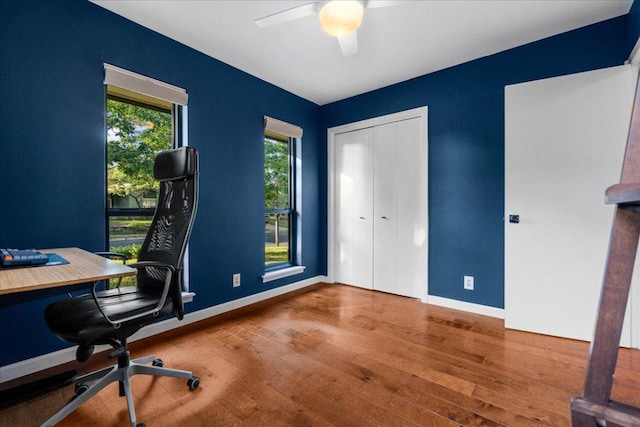 6905 Whispering Oaks Dr, Austin, TX 78745 - home office with hardwood / wood-style floors, baseboards, and a ceiling fan