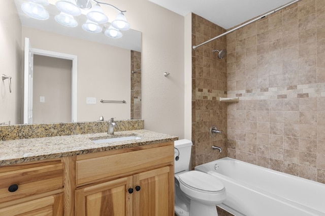 full bathroom featuring toilet, vanity, and  shower combination