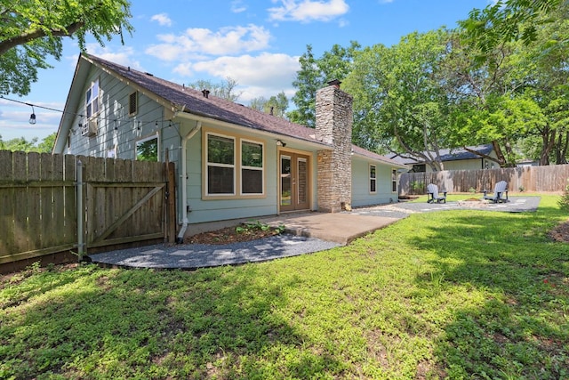 7805 Manassas Dr, Austin, TX 78745 - rear view of house with a chimney, a patio, a fenced backyard, and a gate