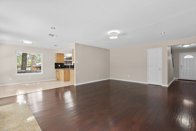 7805 Manassas Dr, Austin, TX 78745 - unfurnished living room with hardwood / wood-style flooring