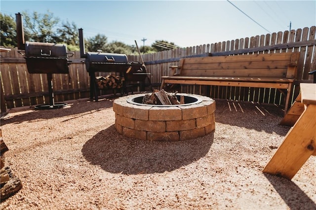 192 Falcon Dr, Luling, TX 78648 - view of patio featuring a fire pit